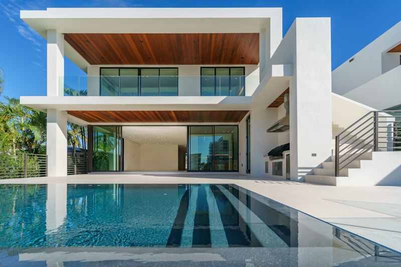 Modern home at twilight with glowing windows
